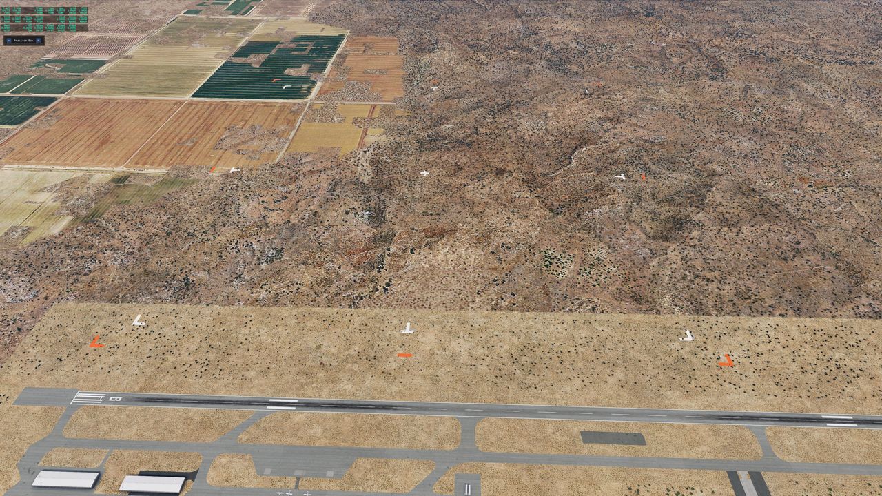 White and orange ground markers for an aerobatic box, with the runway along the near edge.