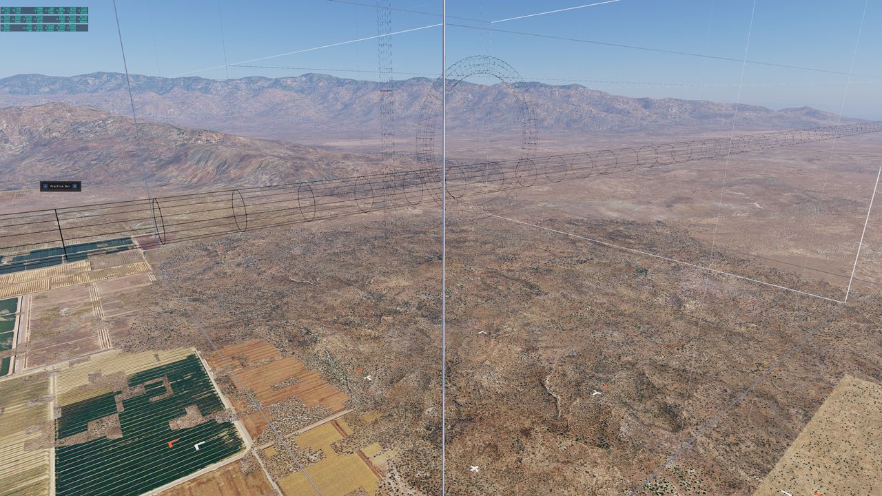 A wireframe roll tube and aerobatic box over desert mountains and farmland.