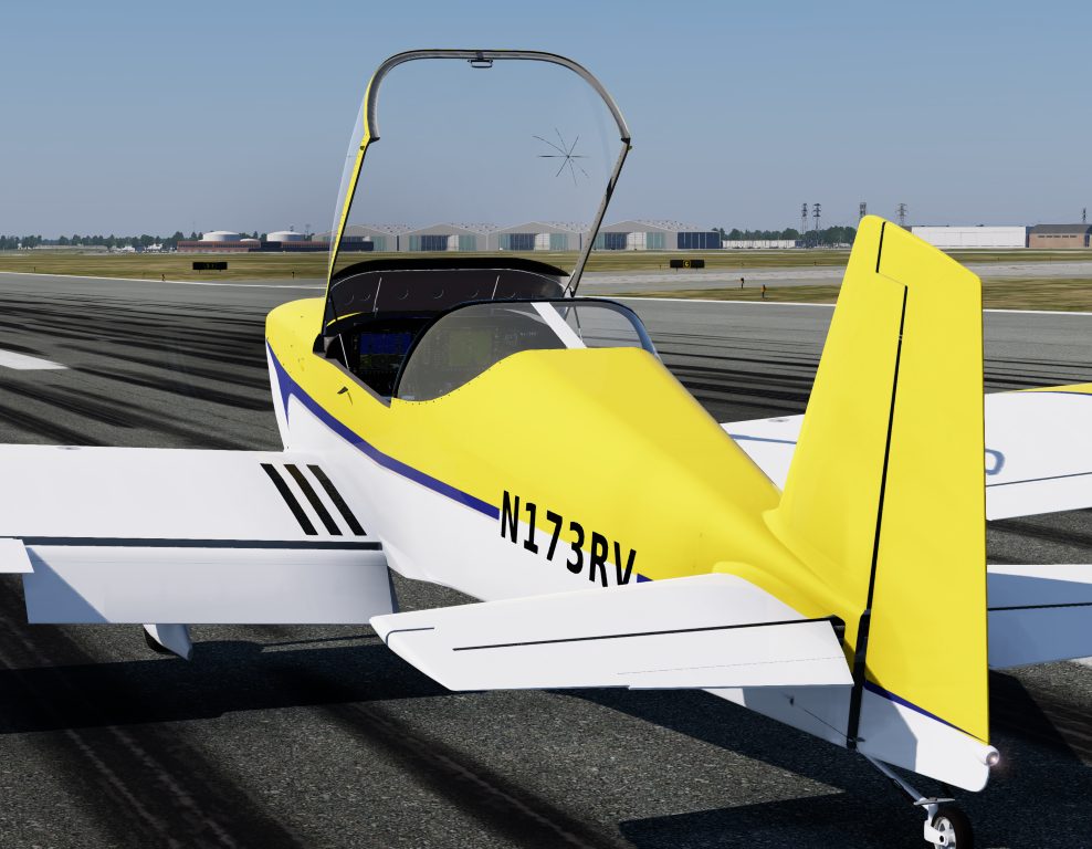 A yellow and white RV-7 on a taxiway with the canopy open.